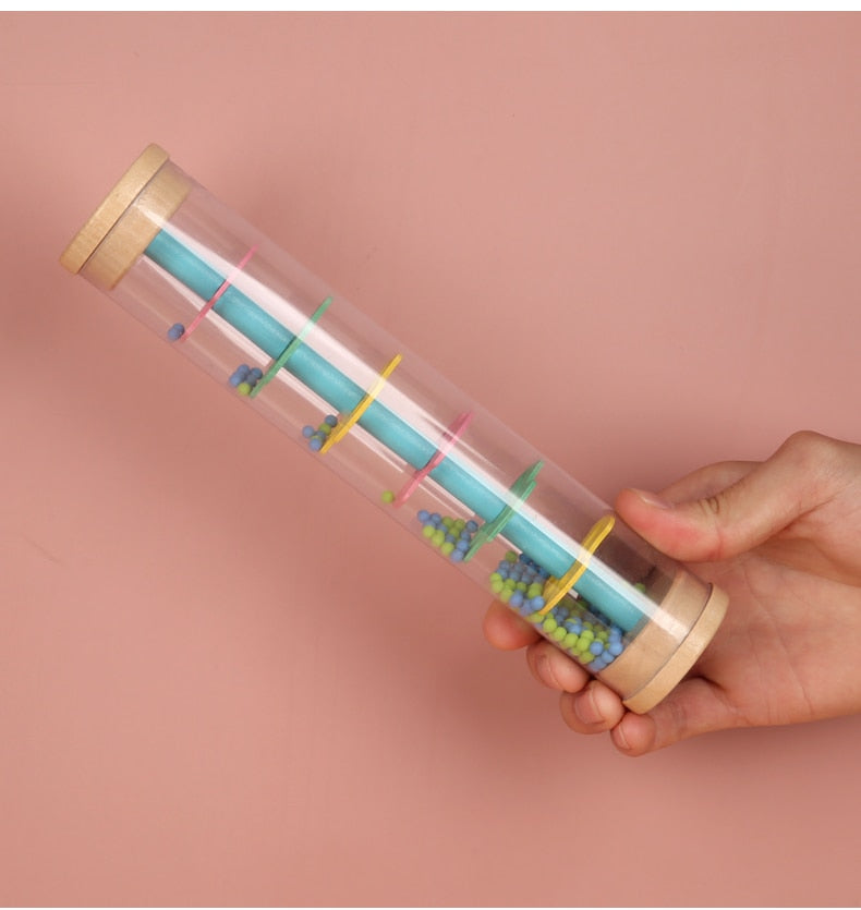 Le bâton de pluie, un instrument traditionnel pour l'éveil musical de votre  bébé
